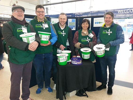 foodbank team collecting donations at train station